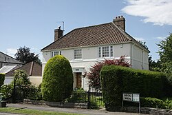 Detached suburban house, painted white