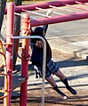 Japanese schoolgirl on some monkey bars (雲梯), 2014