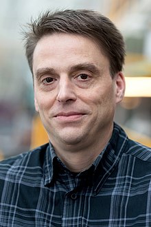 Portrait of Professor John Watrous, taken in the University of Waterloo's Davis Centre in January 2019