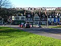 The major crossroads in the village, with the A23 London Road running north to south, Preston Drove (forming the northern boundary of Preston Park) to the east and North Road to the west. This view looks westwards from outside Preston Manor.