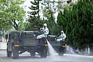 Taiwanese 33rd Chemical Corps spraying disinfectant on a street in Taipei, Taiwan