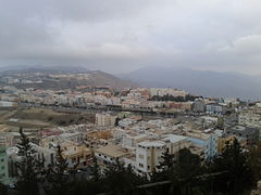 Buildings with the 'Asir Mountains in the background