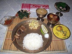 Rice served with vegetables and curries in Assam, India