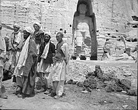 Local men standing near the larger "Salsal" Buddha statue, c. 1940