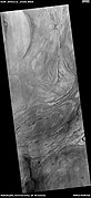 Twisted bands on the floor of Hellas Planitia, as seen by HiRISE under HiWish program These twisted bands are also called "taffy pull" terrain.