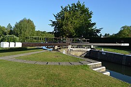 The balance beams typical of many locks on the Upper Thames at Eynsham Lock, Eynsham, Oxfordshire, England. Visible on the gates are the paddle winding gears, used to operate the sluice gates.