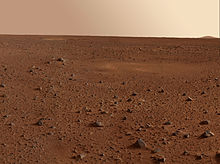 view of Martian desert showing rock field to the horizon