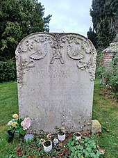 Colour photograph of a sandstone headstone