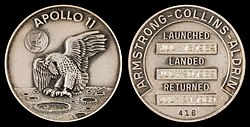 Apollo 11 mission emblem (front). Crew names, dates (launch, lunar landing, and return), and serial number 416 (back)