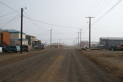 Street view of Utqiagvik in July 2008: This street, like all the others in Utqiagvik, has been left unpaved due to the prevalence of permafrost.