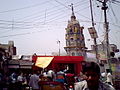 (Outside view of Dhanokhar Mandir (A Temple dedicated primarily to Hanuman) from Dhanokhar Chauraha Barabanki. This temple has a moderate sized pond at its back. Picture taken by me, using LG KP119 (Dynamite) phone. Phot)