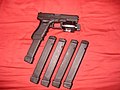 Glock G22 .40 cal with a M6 tactical laser-light combo. Shown with additional 28 round magazines.]]