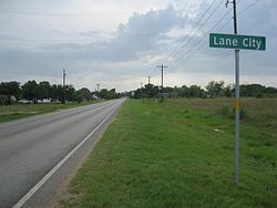Lane City sign on FM 442 looking southwest