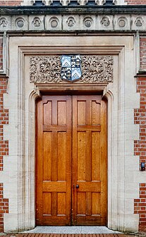 Doorway of the 1895 building, with the Latymer crest and ornamental stonework