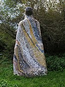 Katy Hallet, The Guardian, mosaic sculpture. On the Tarka Trail by Ladywell Wood. The lettering includes quotes from "Tarka the Otter".