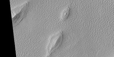 Layered features in Lycus Sulci, as seen by HiRISE under HiWish program