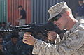 U.S. Marine Corps Cpl. Cory J. Becker, of Golf Company, 2nd Battalion, 7th Marine Regiment, shows Afghan National Police recruits different firing positions using an AMD-65 assault rifle on Lashkar Gah, Afghanistan, June 3, 2008.
