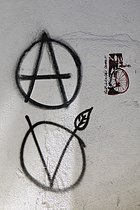 photograph of circle-A and circle-V graffiti on wall