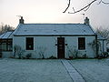 The old mine manager's house. A mound extends into this house's garden.