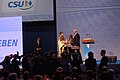 Bundeskanzlerin Angela Merkel erhält auf dem CSU-Parteitag am 12. Dezember 2014 in Nürnberg vom Nürnberger Christkind und Horst Seehofer ein Geschenk.