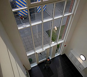 Very high windows in the entrance to a residential building in Ystad