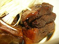 Kakuni is a Japanese braised pork dish which literally means "square simmered".