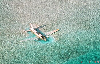 The wreckage of a Curtiss C-46 Commando that crashed in shallow water at Norman's Cay in November 1980 (1999)