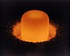 Plutonium-238 glowing because of its radioactivity