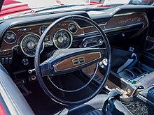 Interior of 1968 Shelby. Visible full gauges and top loader 4 Speed transmission