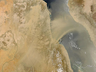 A plume of wind-borne particles from Sudan (left) blow over the Red Sea