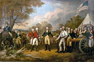 A color painting. In the center is the white-haired Horatio Gates, facing front, wearing a blue military jacket, yellow pants, and knee-length dark boots. His right hand is reaching out to accept the sword of John Burgoyne, who faces to the right, and wears a red coat and white pants. Behind and to his left is another similarly-attired officer. Behind him, and to the left of Gates, are Continental Army soldiers wearing a variety of different uniforms; those on the right of the painting are standing behind a brass cannon, and to the far left is a blue-coated man on a gray horse. The background on the left is countryside with hills visible in the distance, and a partly-cloudy sky. The background on the right includes a white tent, above which waves a flag similar to the United States flag, although it has a smaller number of stars on the blue field, arranged in a square.