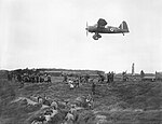 Lysander of No. 13 Squadron provides aiming practice for members of the Home Guard at the Western Command Weapons Training School, Altcar, Lancashire, September 1940.