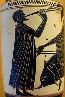 a black figure vase depicting an aulos player.