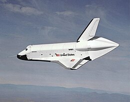 View of a spaceplane gliding through the sky.