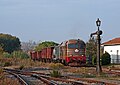 Heritage diesel locomotive approaching the station with a photography charter service.