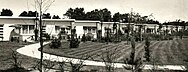 A black-and-white photo of some small tract houses