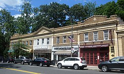 A block of shops on Douglaston Parkway; the National Art League occupies part of this block