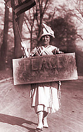 Woman holding a peace sign