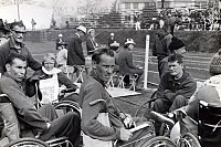 Australian Paralympic Team members in the in-field at the athletics during the 1964 Tokyo Paralympic Games. From left (seated) Frank Ponta, team official John Johnston, Elizabeth Edmondson, unknown and Bill Mather-Brown