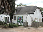 The building dates from the 1820s, possibly as a farmhouse to supply the garrison at Wynberg. It retains many original features, including internal and external joinery. Significant remodelling however occurred in the later Victorian period and further