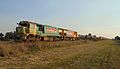 DFTs 7023 and 7036 (in the KiwiRail Phase 2 livery) with a freight train approaching Tinwald.