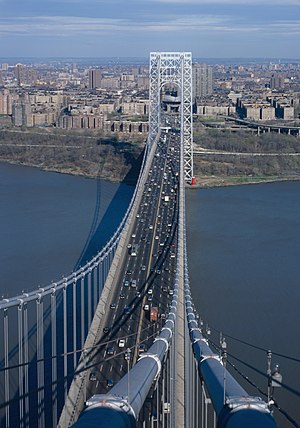 The George Washington Bridge, the world's busiest motor vehicle bridge, crossing the Hudson River with Washington Heights in the background (April 1986)