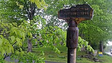 a picture of the bottom of a sign, showing that the Oliver house sign has broken