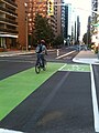 Cycle track with green lanes through intersection in Ottawa, Ontario, Canada (also on Laurier) in 2011.