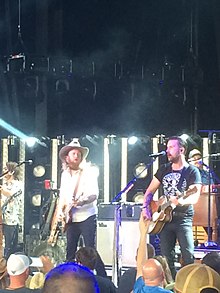 Country music duo Brothers Osborne at a concert in 2018.