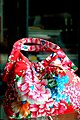 A modern handbag in a traditional Hakka Chinese-style floral fabric design