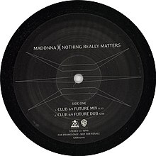 Side one of a black record with a symbol covering the surface and letters mentioning the two versions of the song