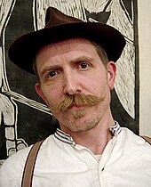 Photograph of Billy Childish whose book Poems to Break the Harts of Impossible Princesses inspired the album's title