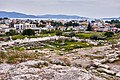 Ruins of the Telesterion at the Sanctuary of Demeter in Eleusis with view to the modern town