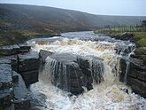 Top drop of the Trough. This is the top fall of the Trough, a 100m limestone gorge in Sleightholme Beck, seen in wet conditions high enough to paddle a kayak down the stream to this point.